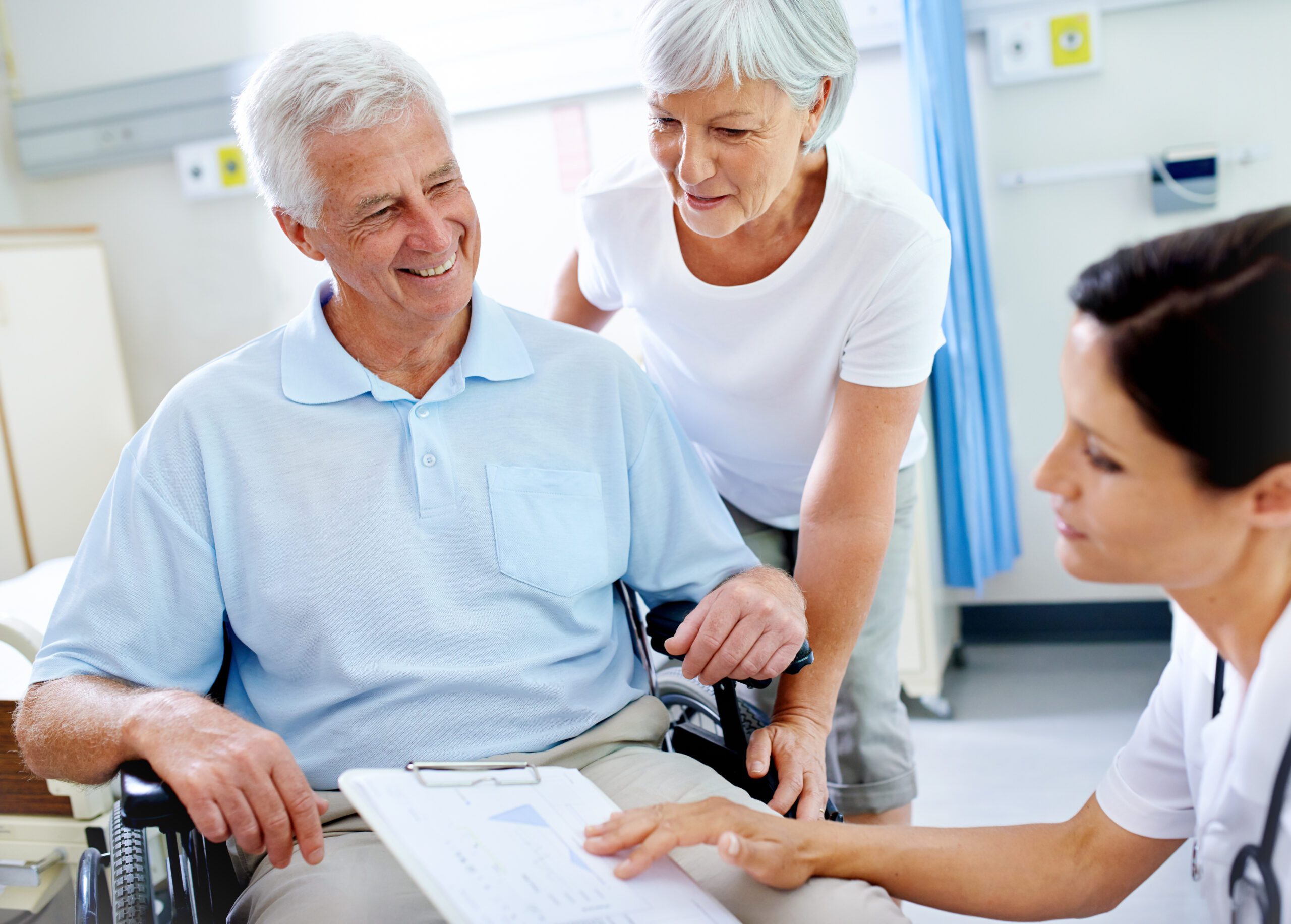 Clipboard, nurse and old man with disability, smile and communication for results of treatment in clinic. Hospital, medical professional and appointment for healthcare, wheelchair and patient